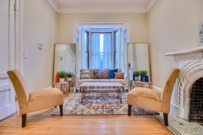 A living room with two chairs and a couch