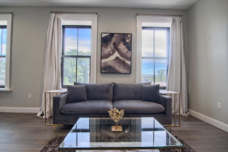 A living room with a couch and coffee table