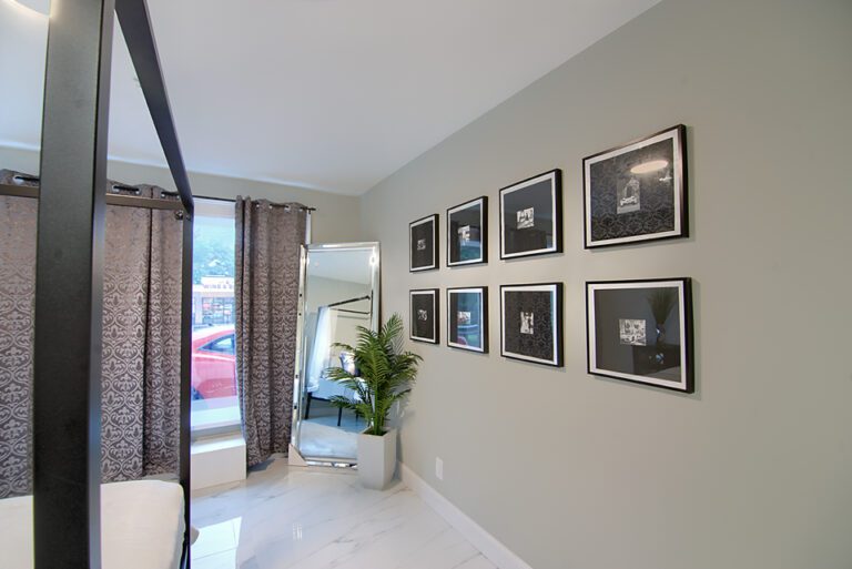 A room with several pictures on the wall.