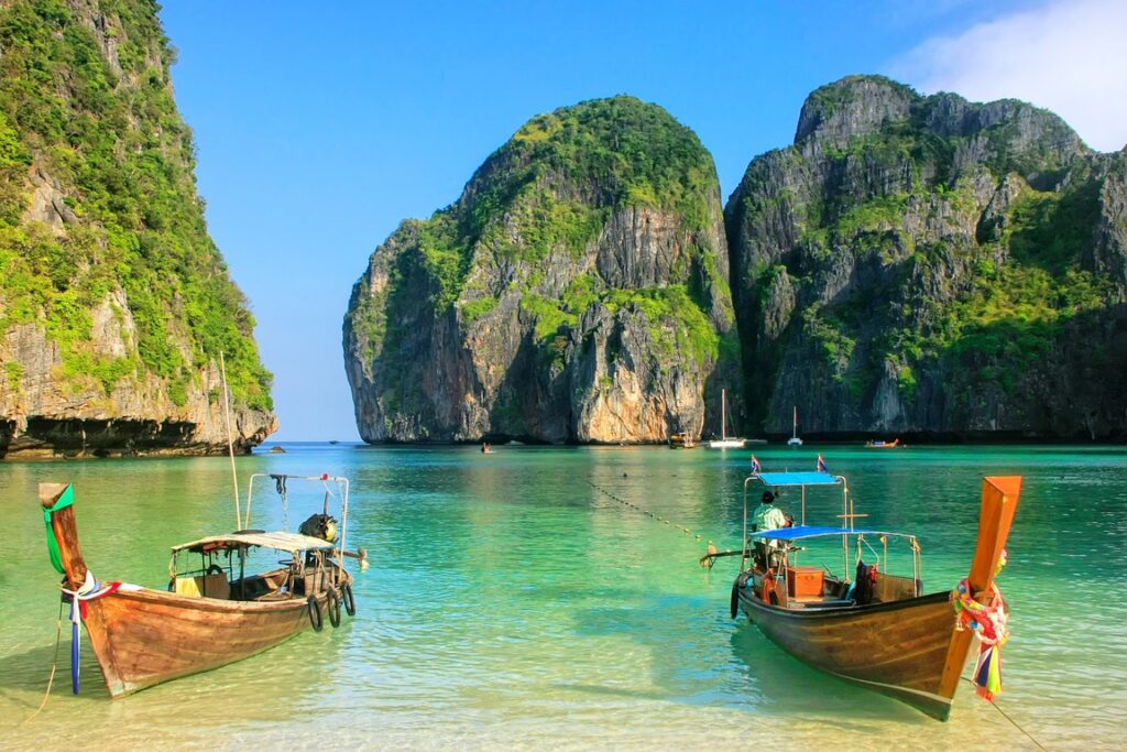 Two boats in the water near a body of water