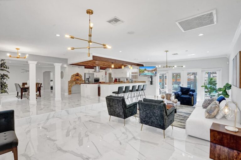 A large room with marble floors and white walls.