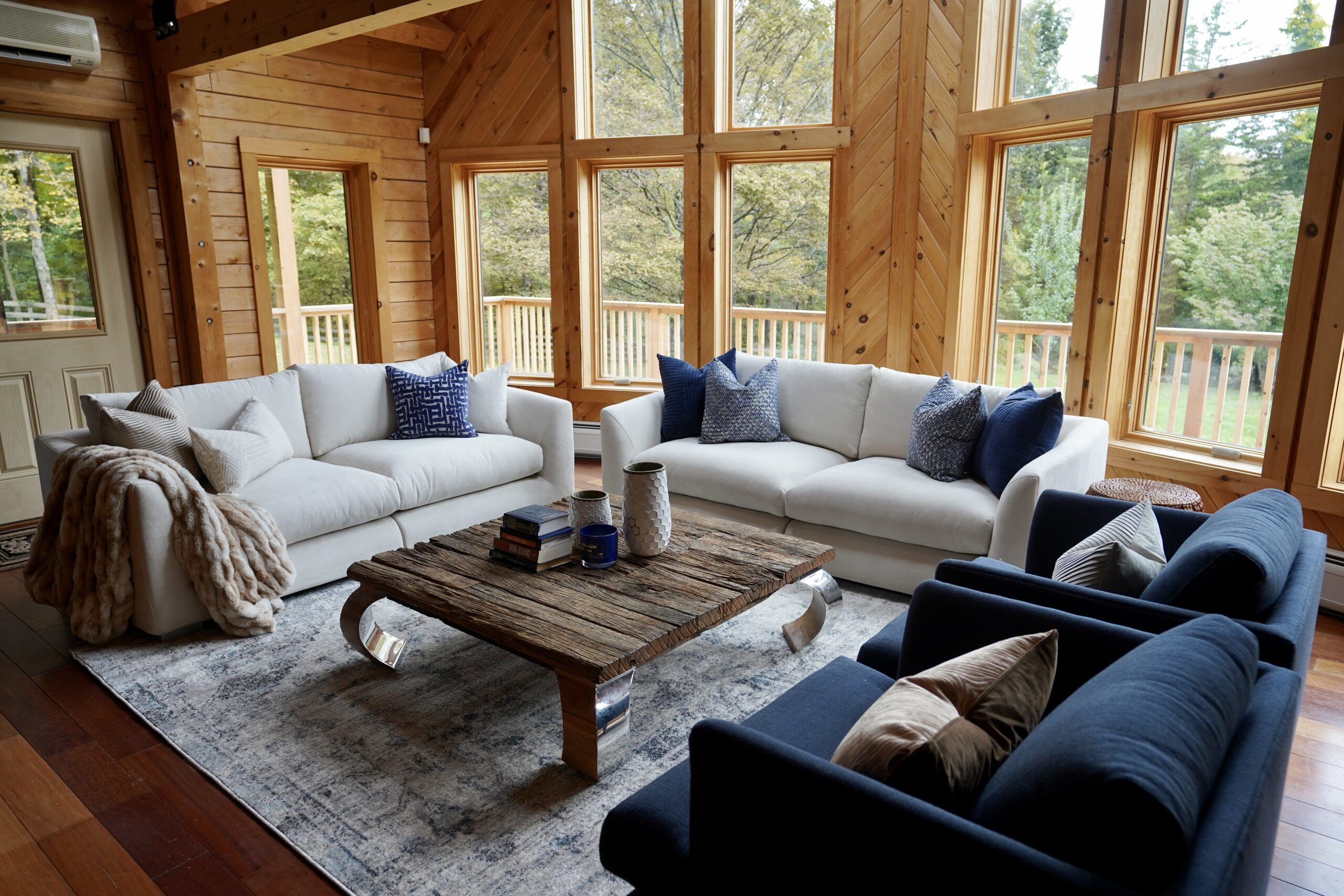 A living room with couches and tables in it